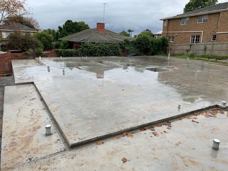 Finished concrete slab surface with layout markings demonstrating quality standards and precision