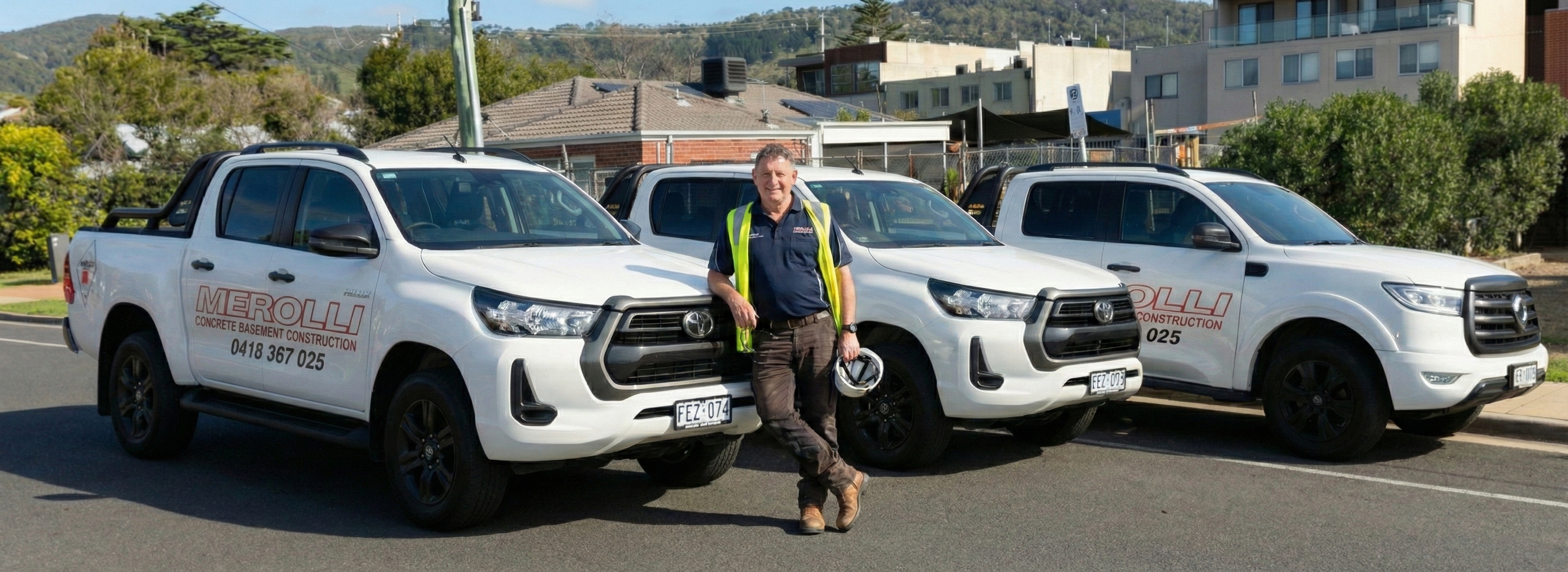 Concrete Basement Construction team with vehicles
