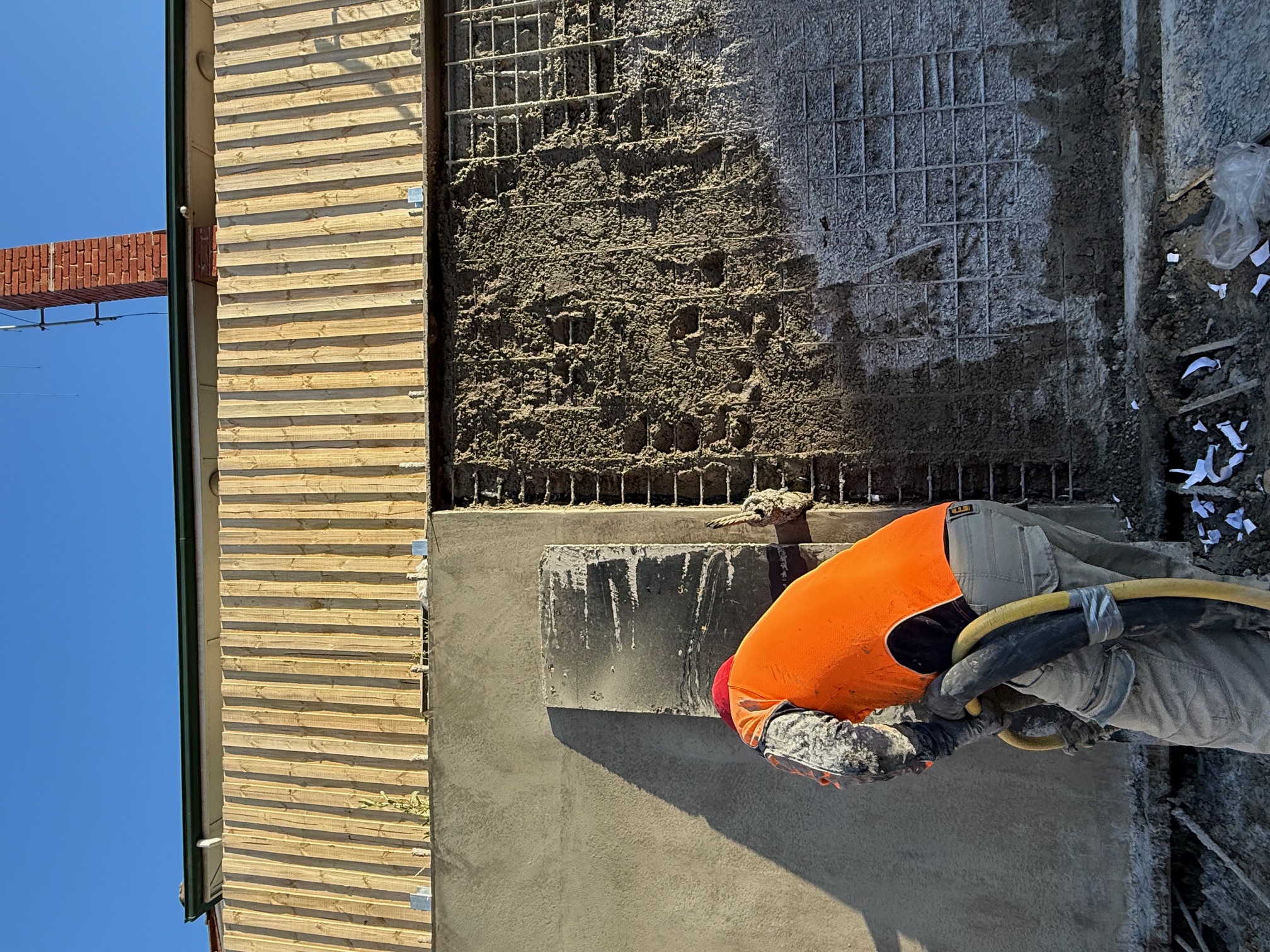 Concrete basement construction site with team